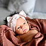 baby, infant, headband, bow, blanket, wrapped, soft, cute, portrait, indoors, newborn, child, face, expression, gaze, cozy, skin, sleepy, resting, young