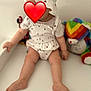 baby, child, hat, white_clothing, heart_pattern, sitting, toys, teddy_bear, rainbow, minnie_mouse, indoor, cute, legs, barefoot, plush_toy, colorful, soft_toy, infant, white_background, red_heart_emoji