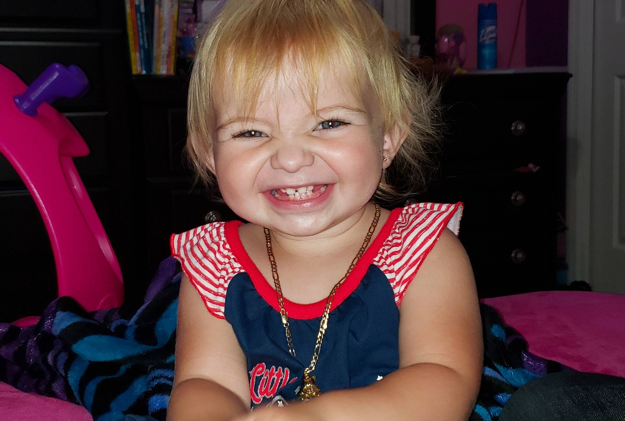 Skylar joined the competition — help win amazing prizes! blond, cheek, child, ear, eye, face, facial_expression, finger, fun, hair, hairstyle, iris, joy, laugh, organ, person, pink, sitting, smile, toddler