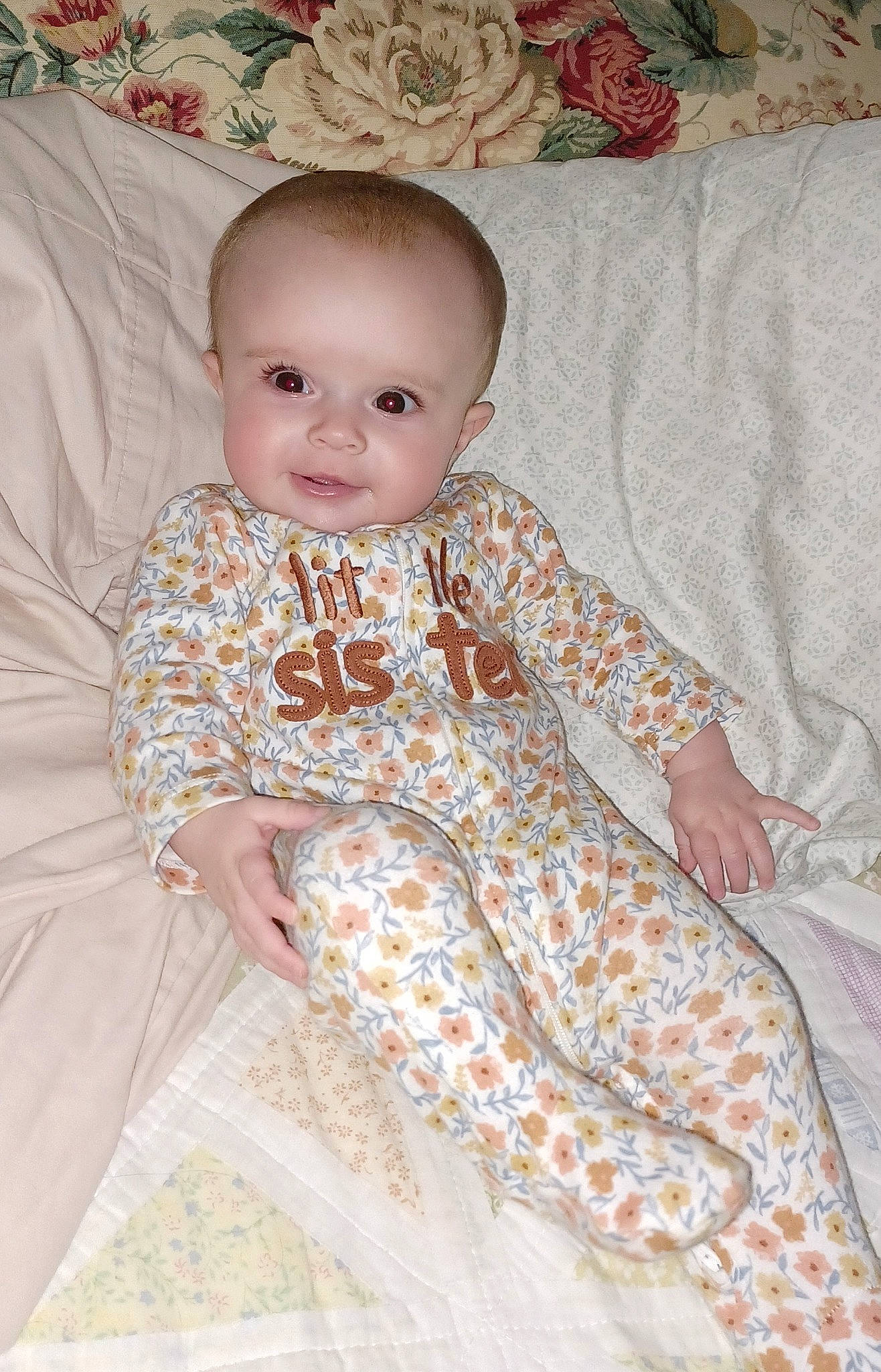 Emily joined the competition — help win amazing prizes! baby, baby_toddler_clothing, child, comfort, day_dress, dress, embellishment, eye, flooring, happy, iris, linens, one_piece_garment, pattern, peach, person, portrait_photography, sitting, sleeve, toddler