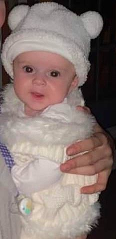 Emily joined the competition — help win amazing prizes! baby, baby_toddler_clothing, cap, cheek, child, embellishment, event, eye, eyebrow, fun, fur, happy, headgear, headwear, iris, lip, person, pink, skin, sleeve