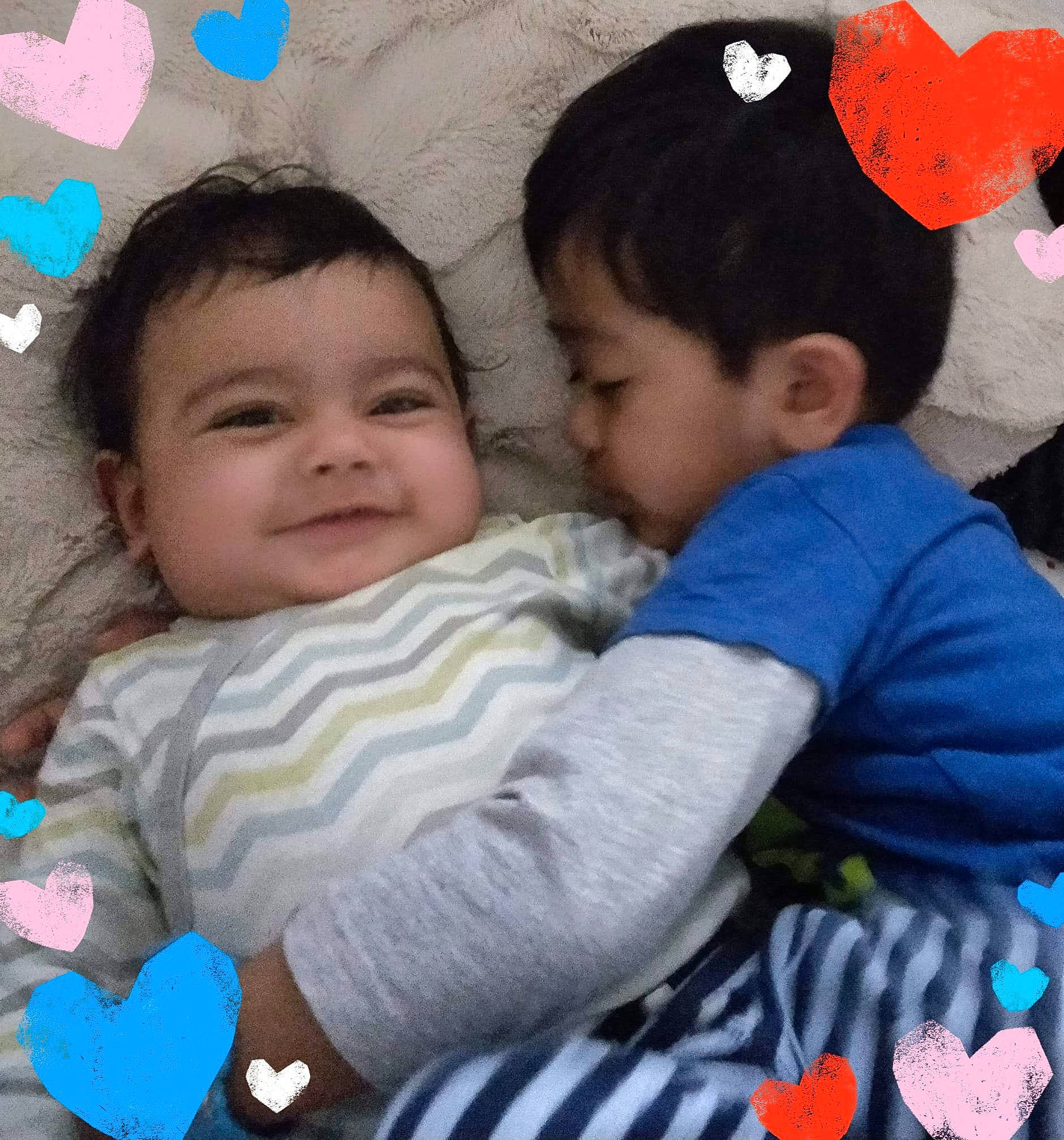 Ritham is registered to the contest to win money with this photo: baby, baby_products, baby_toddler_clothing, child, happy, hug, interaction, love, person, play, product, sibling, smile, stuffed_toy, toddler