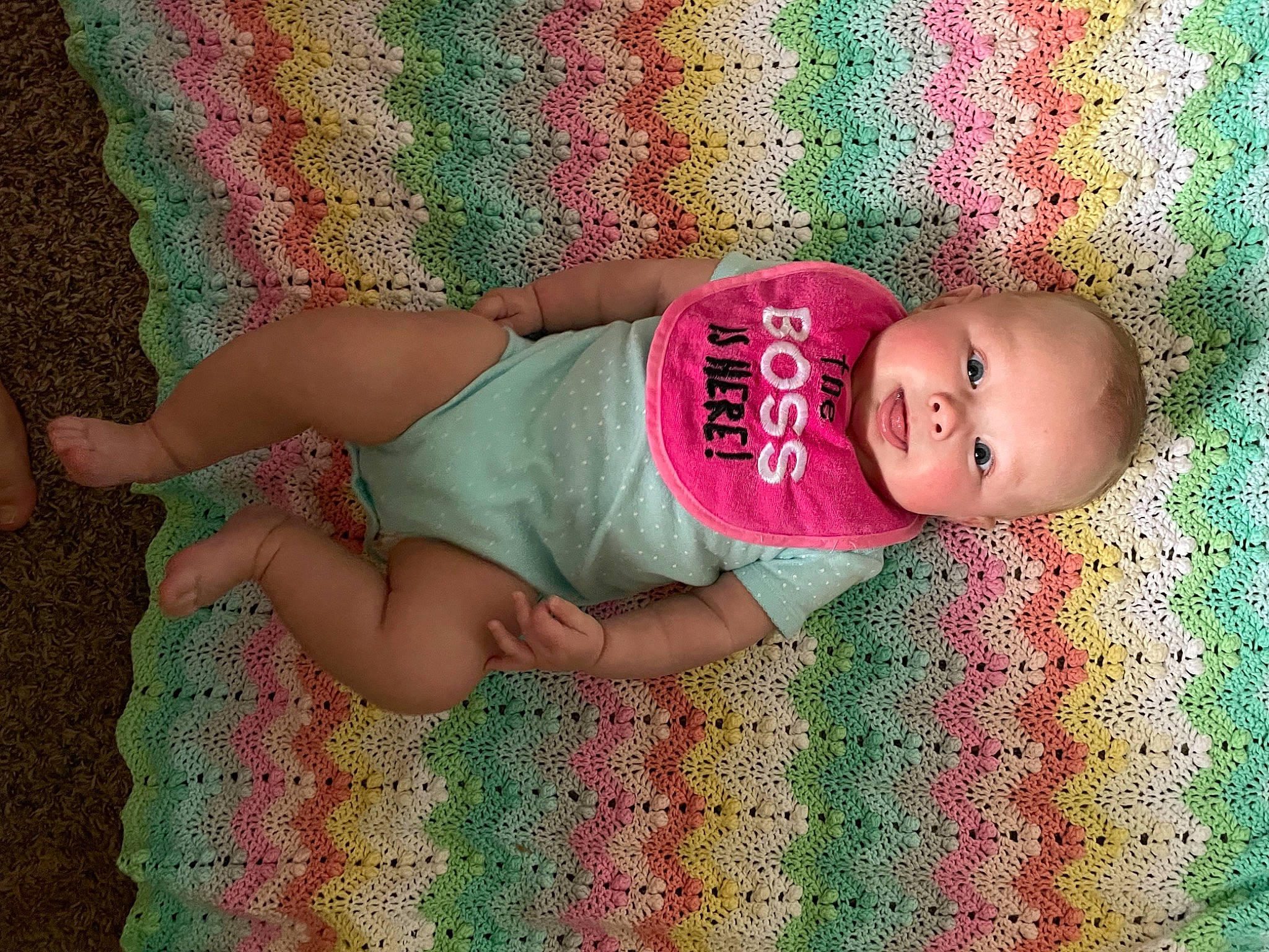 Miranda joined the competition — help win amazing prizes! arm, baby, baby_toddler_clothing, dress, face, finger, green, hand, happy, human_body, joint, leg, pattern, person, pink, skin, sleeve, smile, textile, thigh