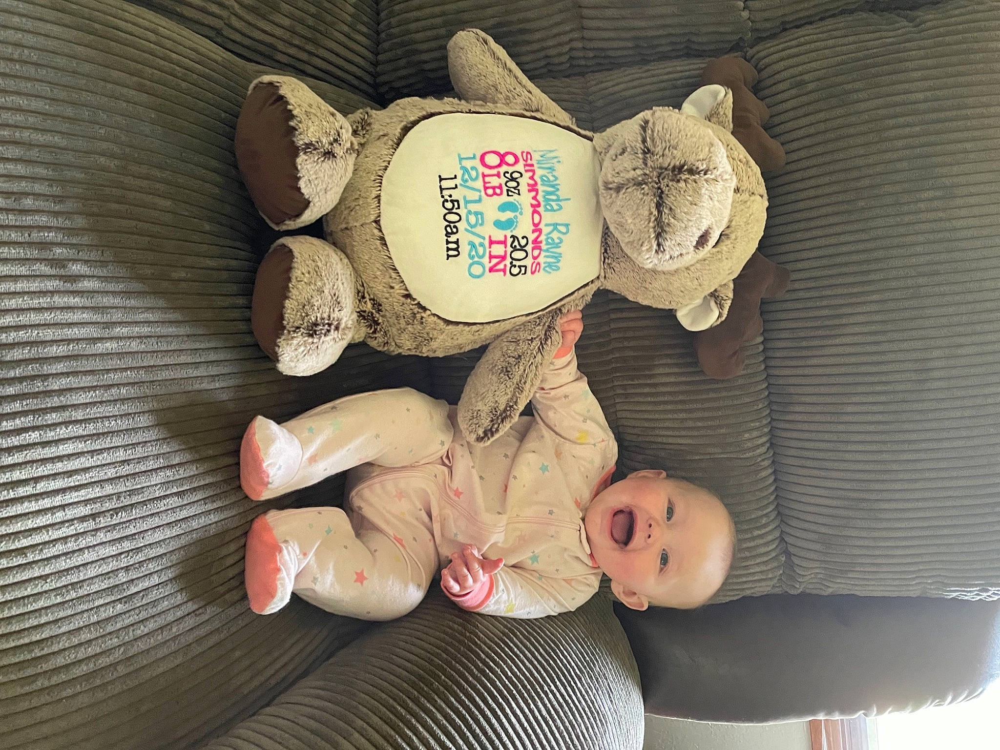 Miranda is registered to the contest to win money with this photo: baby, baby_products, baby_sleeping, baby_toddler_clothing, child, circle, comfort, foot, linens, person, room, sitting, sock, toddler, wood