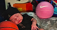 Bjorn Pineda joined the competition — help win amazing prizes! baby, sleeping, basketball, nike, jordan, black_clothing, hat, shoes, sneakers, sports, toy_basketball, boxes, pink_basketball, infant, resting, footwear, logo, indoor, soft_surface, cute