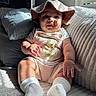 baby, child, infant, hat, romper, winnie_the_pooh, couch, pillows, sunlight, window_blinds, striped_clothing, socks, indoors, cute, smiling, plush, cozy, portrait, seated, home