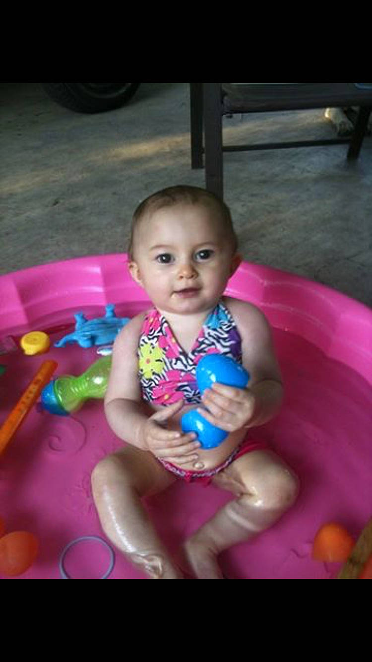 Allison is registered to the contest to win money with this photo: baby, child, fun, magenta, person, play, sitting, skin, smile, toddler