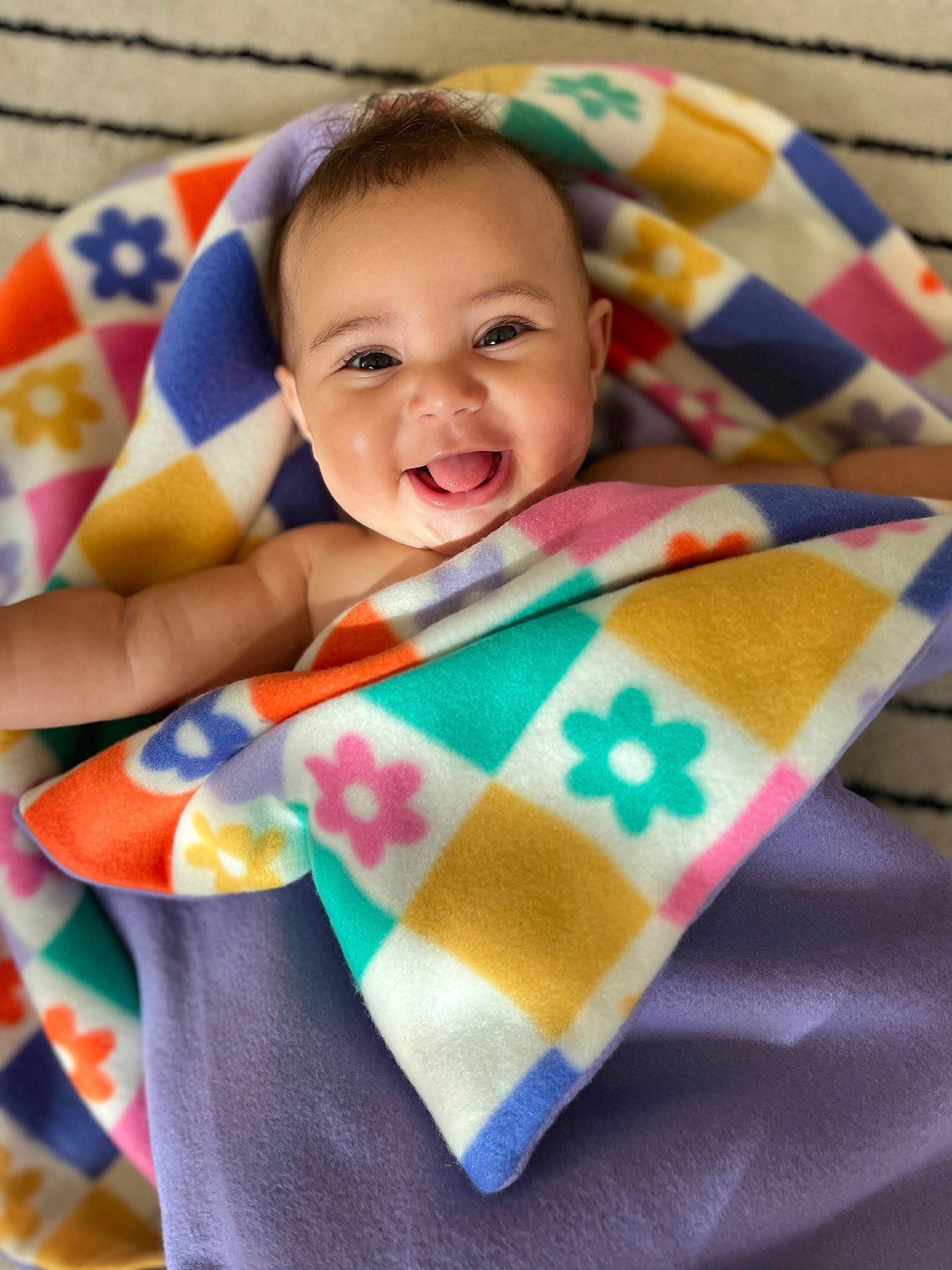 Halo is registered to the contest to win money with this photo: art, baby, baby_products, baby_toddler_clothing, bedding, child, comfort, couch, craft, face, fun, happy, linens, pattern, person, play, sleeve, smile, t_shirt, textile