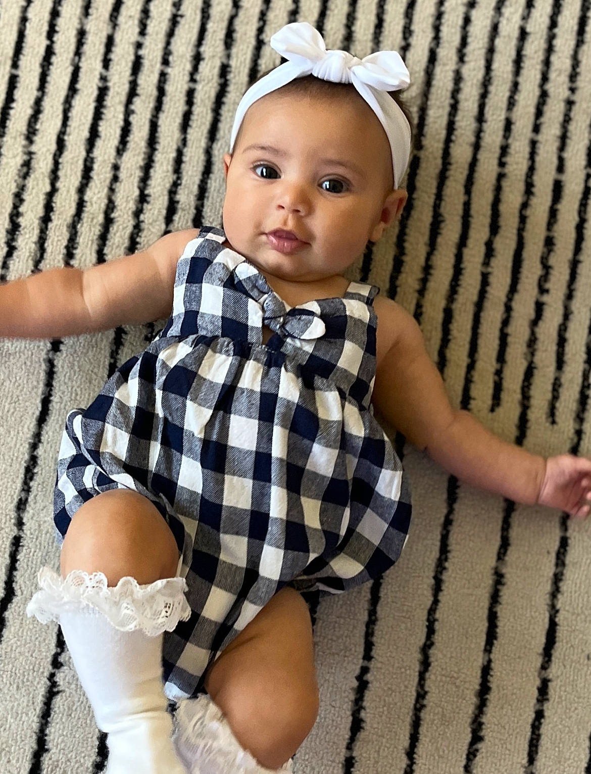 Halo is registered to the contest to win money with this photo: baby_toddler_clothing, eye, face, finger, hairstyle, head, human_leg, knee, leg, pattern, person, plaid, skin, sleeve, sock, tartan, thigh, toddler, toy, trunk