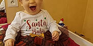 Louciana participe au concours pour gagner de l'argent avec cette photo : baby, child, smiling, tutu, headband, red_shoes, holiday_clothing, santa_baby, plaid, tights, indoor, changing_pad, happy, cute, infant, face, sitting, red_flower, white_tights, joyful