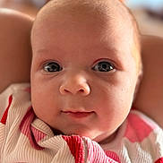 Baela joined the competition — help win amazing prizes! baby, infant, face, eyes, closeup, portrait, skin, blanket, red, white, clothing, cute, child, newborn, soft, expression, person, indoors, young, head