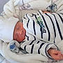 ézékiel a rejoint le concours — aidez-le/la à gagner de superbes lots ! newborn, baby, sleeping, hat, striped_clothing, blanket, cozy, infant, soft, peaceful, person, cute, resting, wrapped, hand, portrait, indoor, young_child, warm, snug