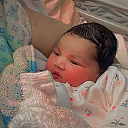 Sabreen is registered to the contest to win money with this photo: newborn, baby, blanket, hospital, bed, infant, sleepwear, soft, cozy, portrait, person, face, human, cute, resting, tender, newborn_clothes, child, indoor, warm