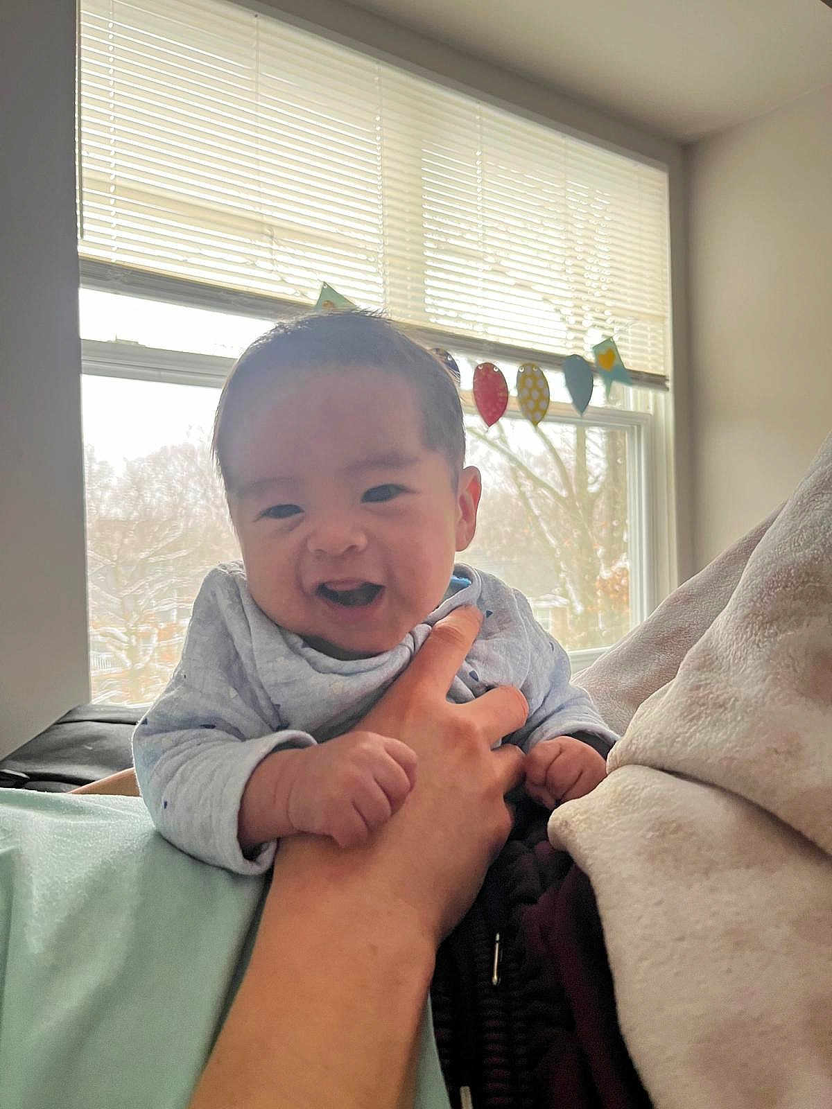 Uziel joined the competition — help win amazing prizes! baby, child, smiling, hand, window, indoor, light, person, clothing, decorations, face, happy, infant, human, portrait, holding, expression, cute, skin, sleeve