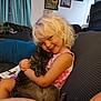 Allison joined the competition — help win amazing prizes! child, cat, couch, smile, blonde_hair, curly_hair, indoor, hug, pet, tabby_cat, happy, cozy, home, furniture, person, relaxing, portrait, childhood, cute, comfort