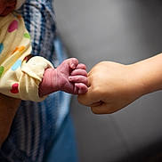 Harper is registered to the contest to win money with this photo: ankle, arm, baby, bodypart, face, finger, hand, head, holdinghands, massage, newborn, person, toe, wrist