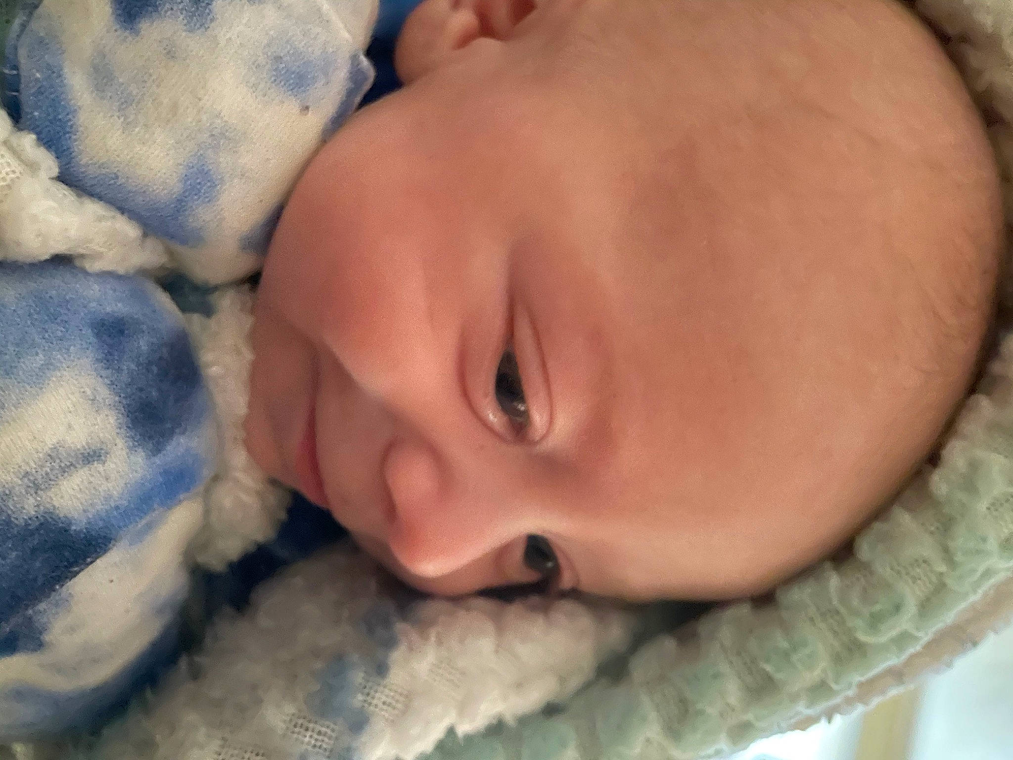 Tyler is registered to the contest to win money with this photo: baby, baby_toddler_clothing, cheek, chin, comfort, eyebrow, eyelash, face, finger, forehead, hand, happy, headgear, iris, lip, mouth, nose, person, skin, smile