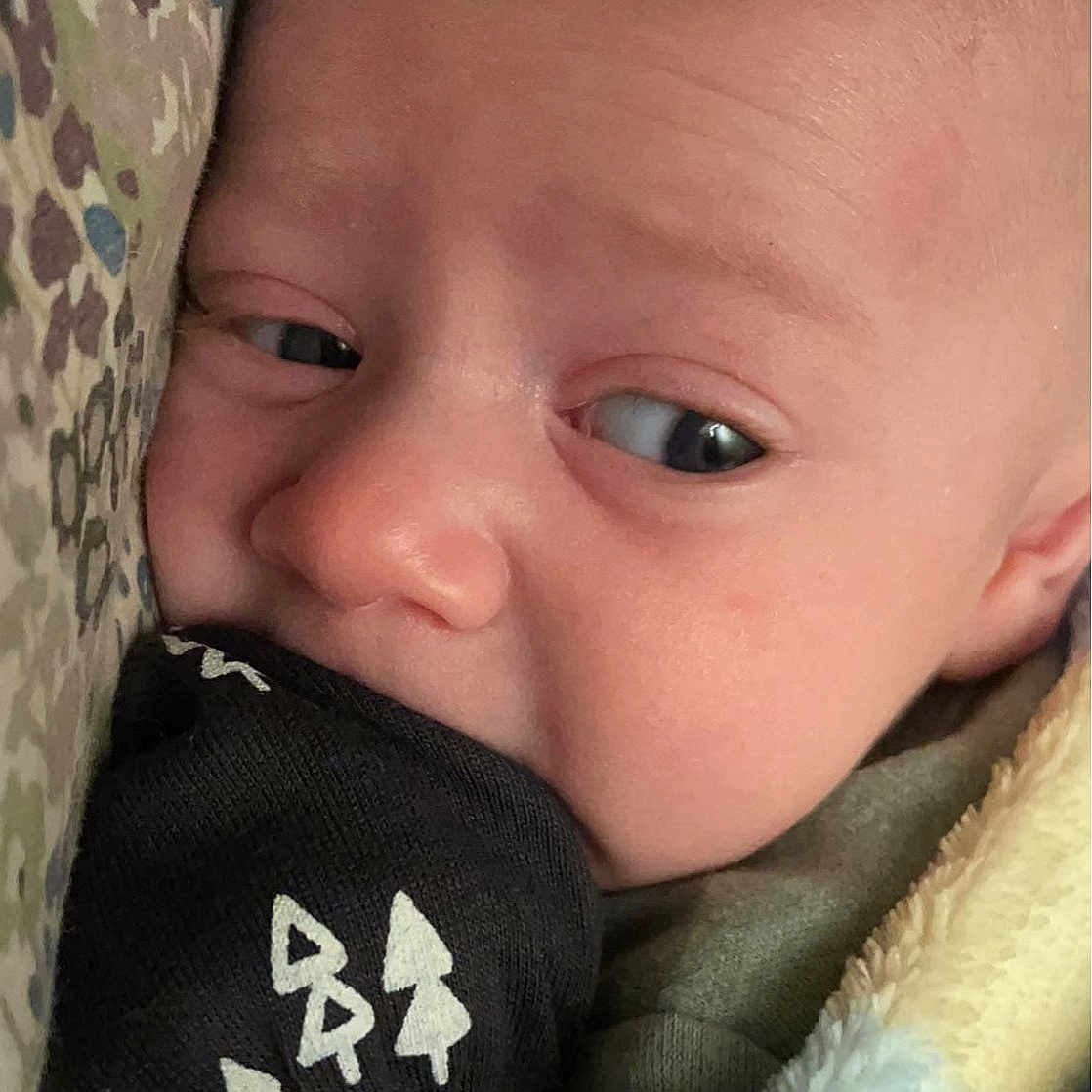 Tyler is registered to the contest to win money with this photo: baby, baby_toddler_clothing, cheek, chin, comfort, ear, eye, eyebrow, eyelash, finger, forehead, hairstyle, happy, human_body, iris, lip, mouth, neck, nose, skin