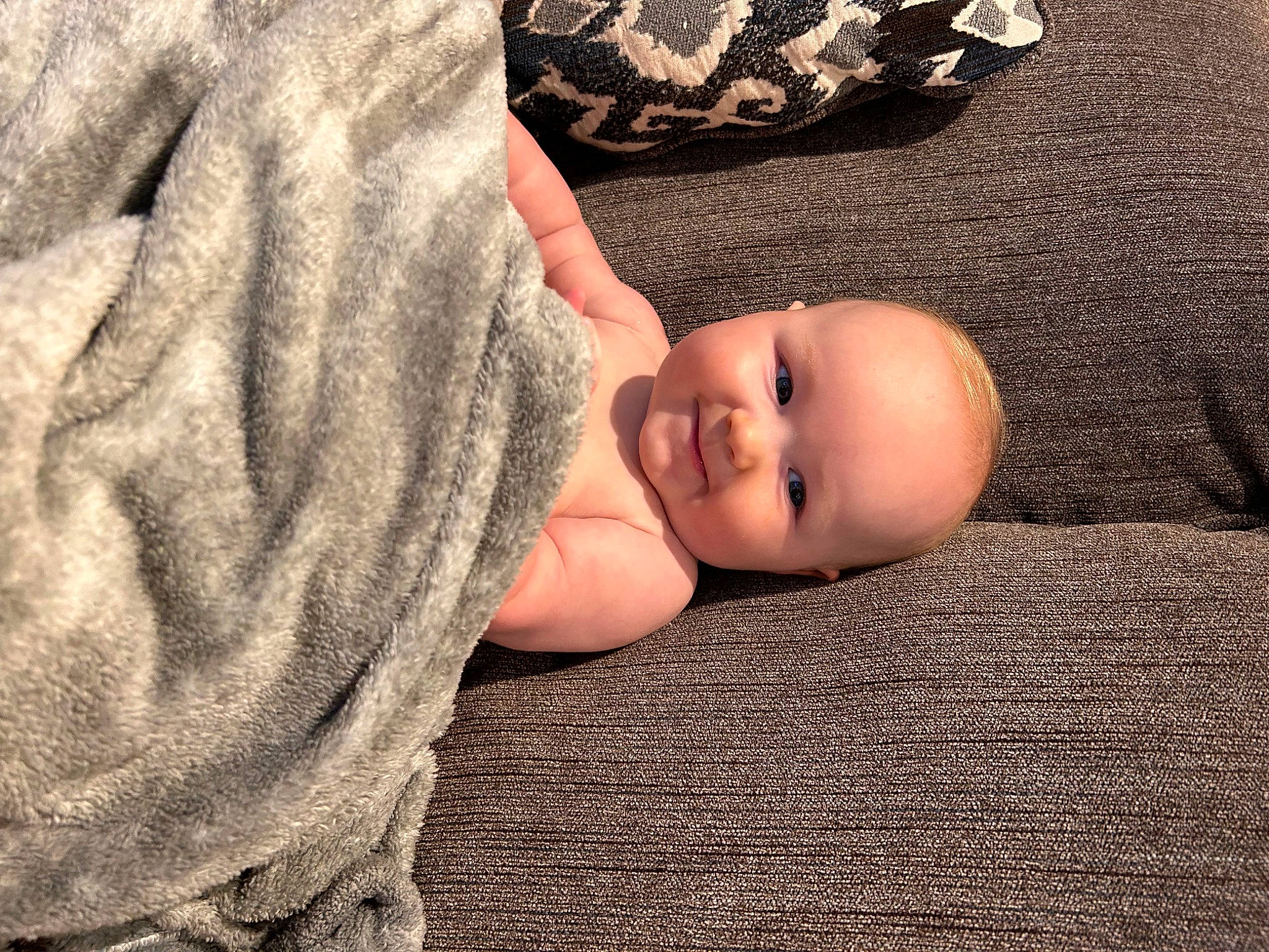 Maxwell Ethan is registered to the contest to win money with this photo: baby, baby_toddler_clothing, cheek, child, comfort, eye, flash_photography, flooring, fur, grass, joy, linens, nail, pattern, person, portrait_photography, sitting, sleeve, smile, toddler