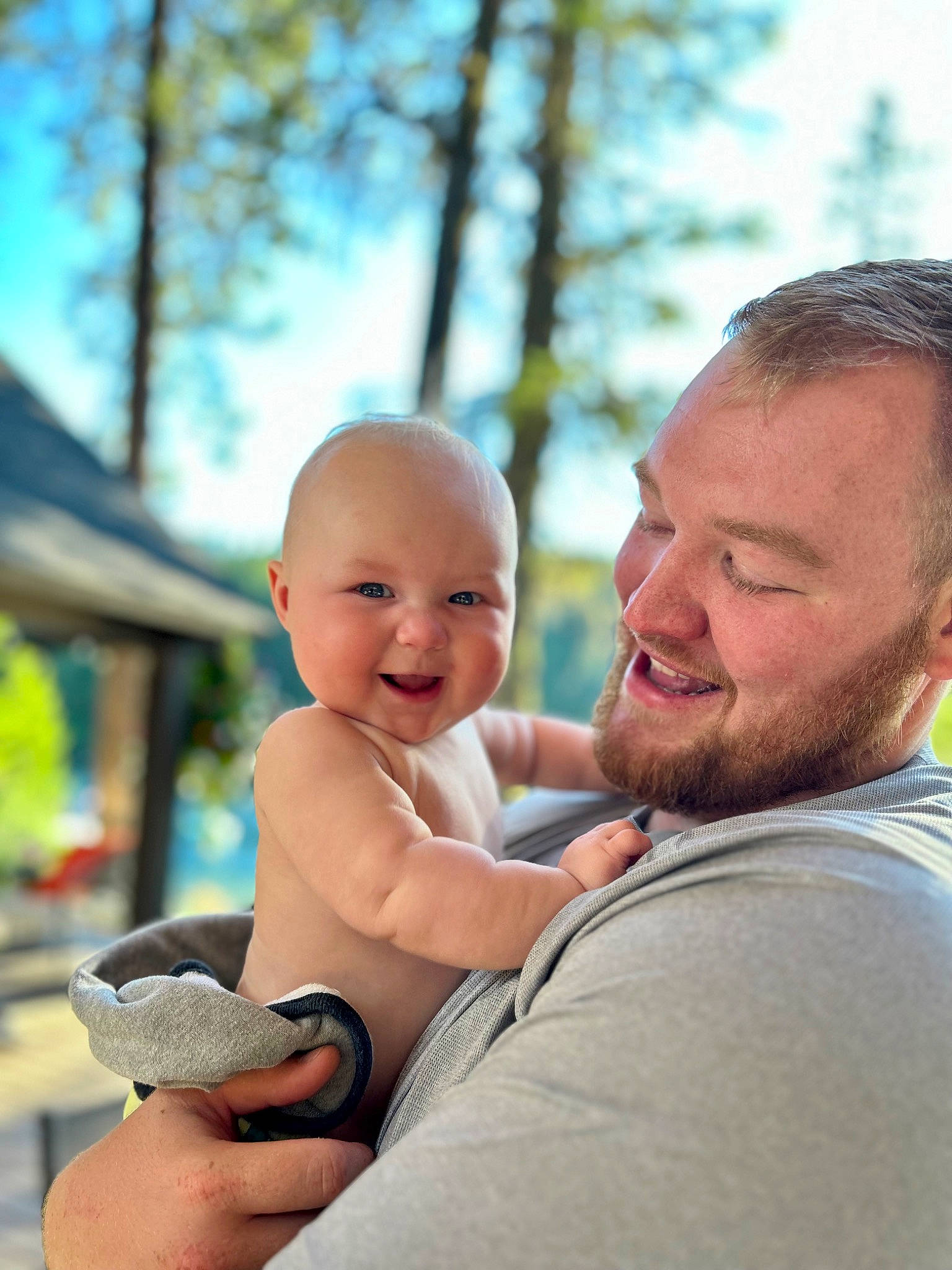 Maxwell Ethan is registered to the contest to win money with this photo: baby, beard, child, event, fun, gesture, grass, happy, joy, laugh, leisure, person, recreation, sitting, skin, sky, smile, t_shirt, thumb, toddler