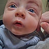 Von joined the competition — help win amazing prizes! baby, close_up, face, blue_eyes, chubby_cheeks, infant, curious_expression, hand, soft_blanket, light_clothing, indoors, skin, head_support, young_child, portrait, cute, person, nose, mouth, eyebrows