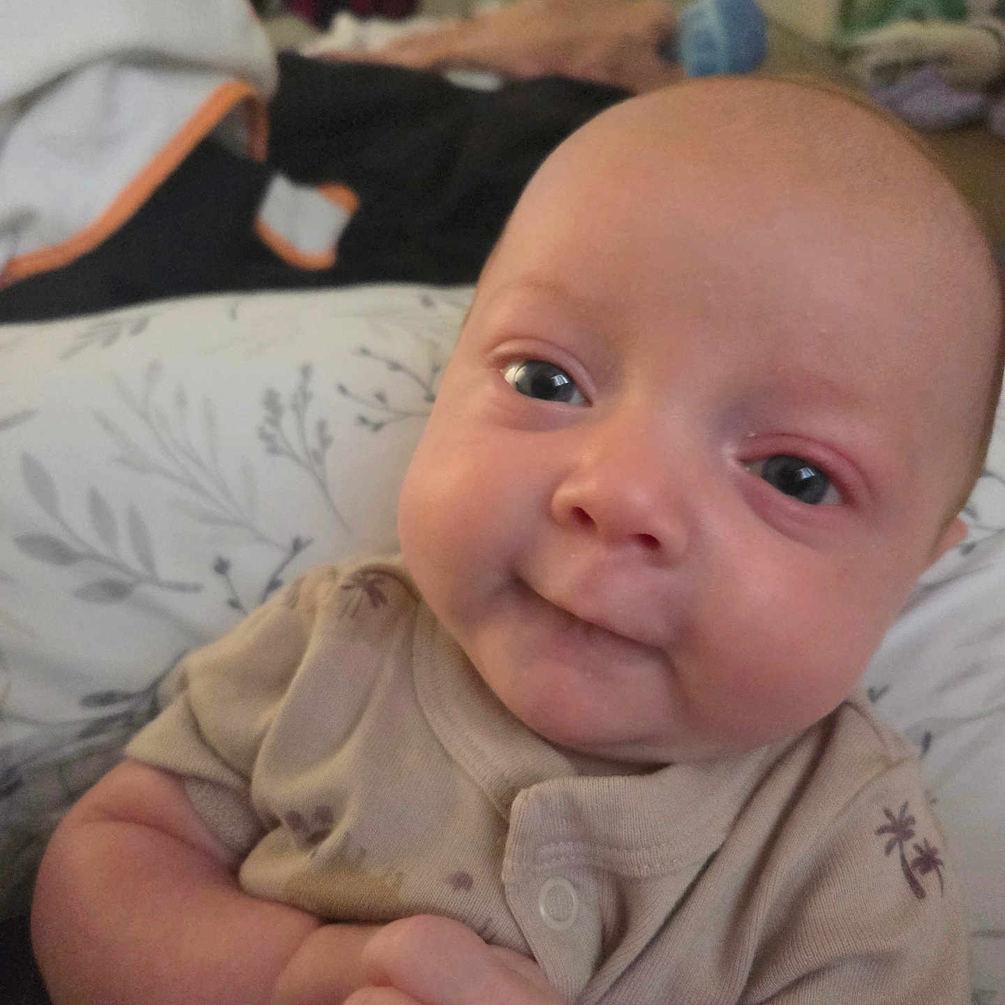 Von joined the competition — help win amazing prizes! baby, infant, face, smile, clothing, blanket, indoor, person, cute, portrait, young_child, baby_clothes, expression, skin, hand, head, eyes, cozy, soft, background