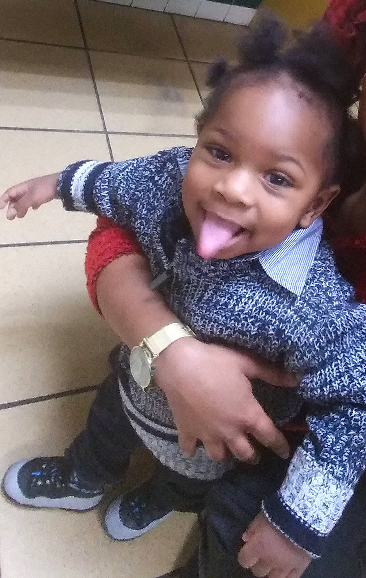 Amaziah is registered to the contest to win money with this photo: arm, black_hair, cheek, child, finger, leg, person, sitting, skin, smile, toddler