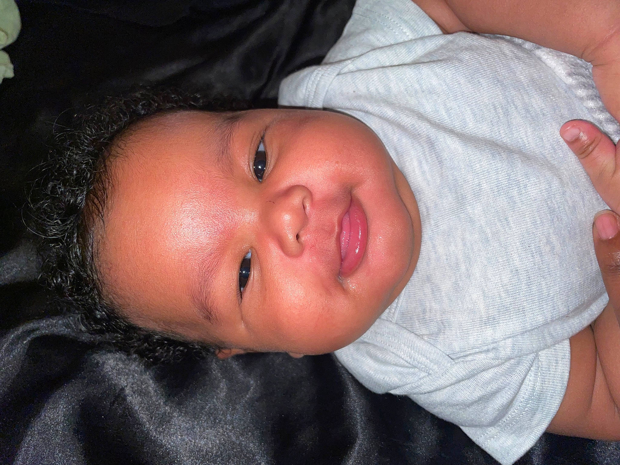 Angelo is registered to the contest to win money with this photo: baby, baby_toddler_clothing, cheek, chest, child, ear, eye, eyebrow, eyelash, finger, gesture, hand, head, iris, lip, mouth, neck, nose, person, skin