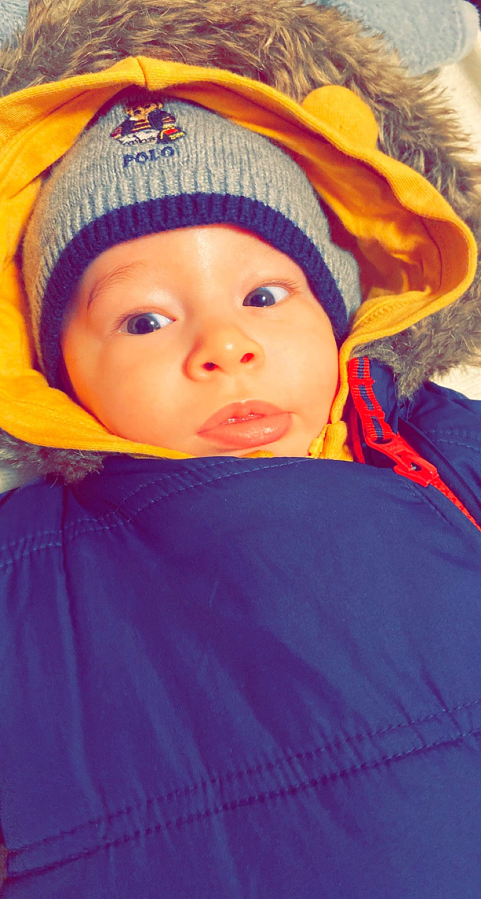 Kéziah participe au concours pour gagner de l'argent avec cette photo : baby, cap, cheek, child, comfort, electric_blue, eyebrow, fashion_accessory, fun, happy, headgear, headwear, human_body, iris, knit_cap, lip, magenta, nose, person, purple