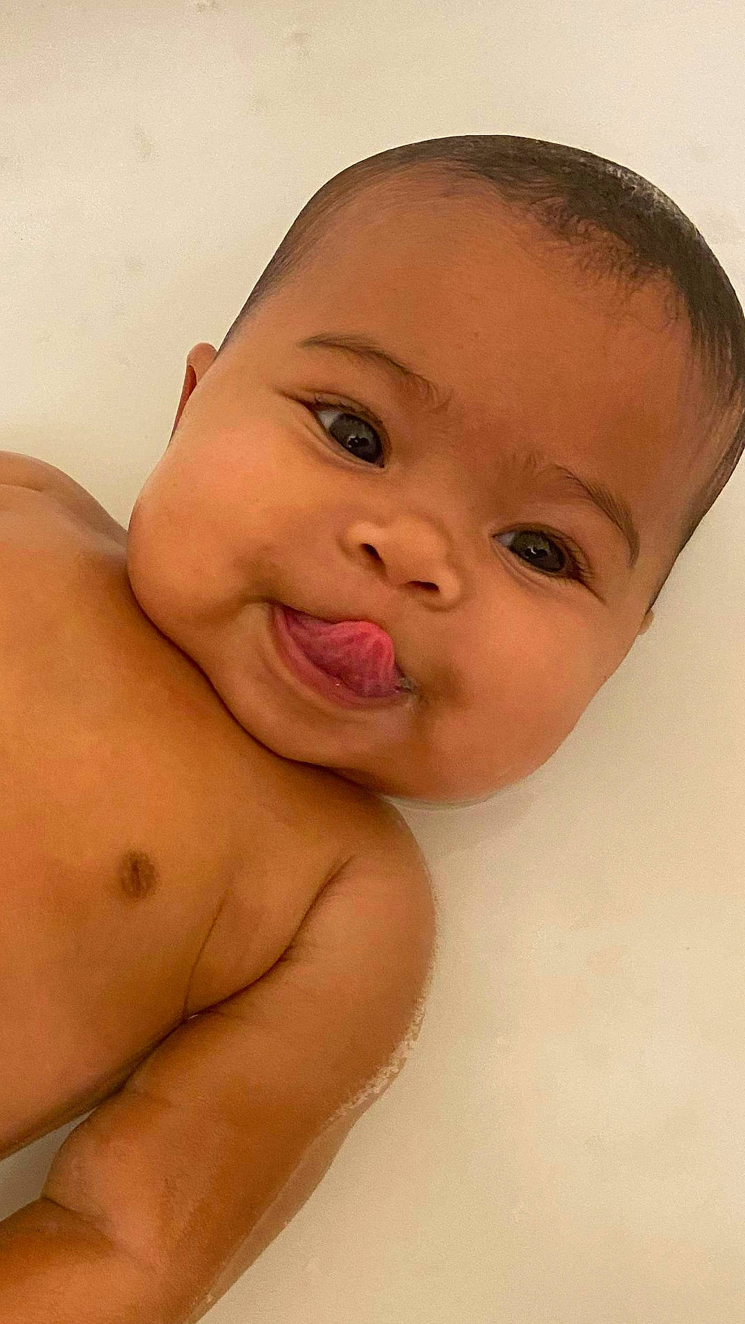 Kiya is registered to the contest to win money with this photo: baby, cheek, chest, child, chin, close_up, eye, eyebrow, face, forehead, head, lip, mouth, muscle, neck, nose, person, photography, skin, smile