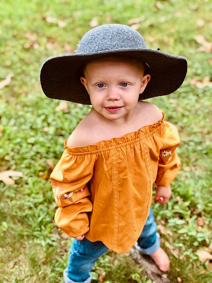 Braelyn joined the competition — help win amazing prizes! baby, baby_toddler_clothing, child, clothing, eye, face, grass, grassland, happy, hat, head, headgear, headwear, leaf, mammal, people_in_nature, person, plant, skin, sleeve