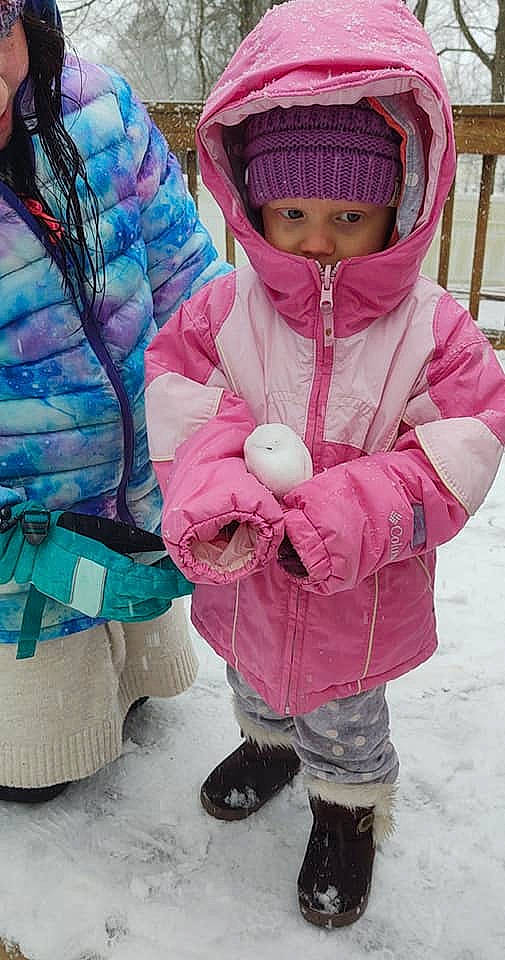 Braelyn is registered to the contest to win money with this photo: freezing, fun, glove, headgear, headwear, human_body, jacket, mammal, outerwear, person, photograph, pink, product, recreation, shoe, sleeve, sneakers, snow, textile, toddler