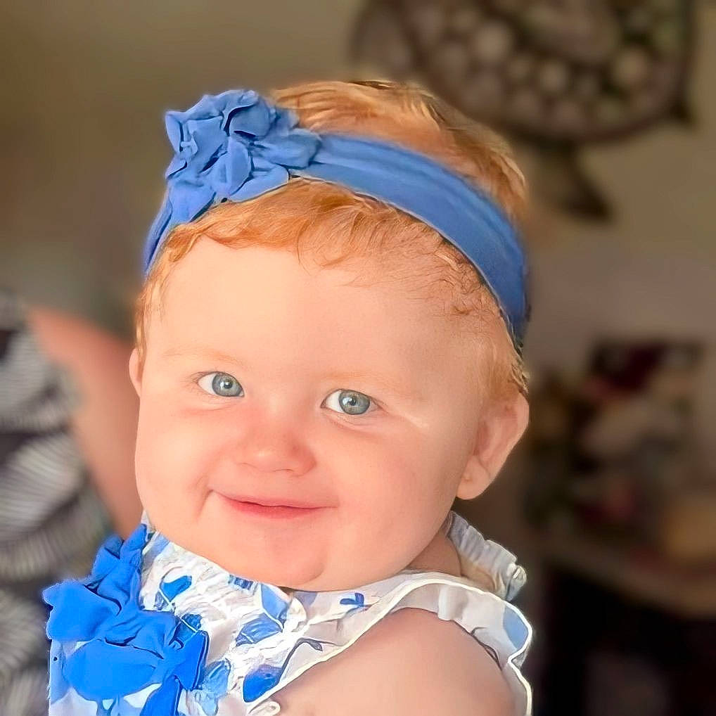 Ellie is registered to the contest to win money with this photo: baby, baby_toddler_clothing, beauty, chin, ear, electric_blue, eye, eyebrow, eyelash, face, happy, head, headband, headgear, headpiece, iris, joy, people, person, skin
