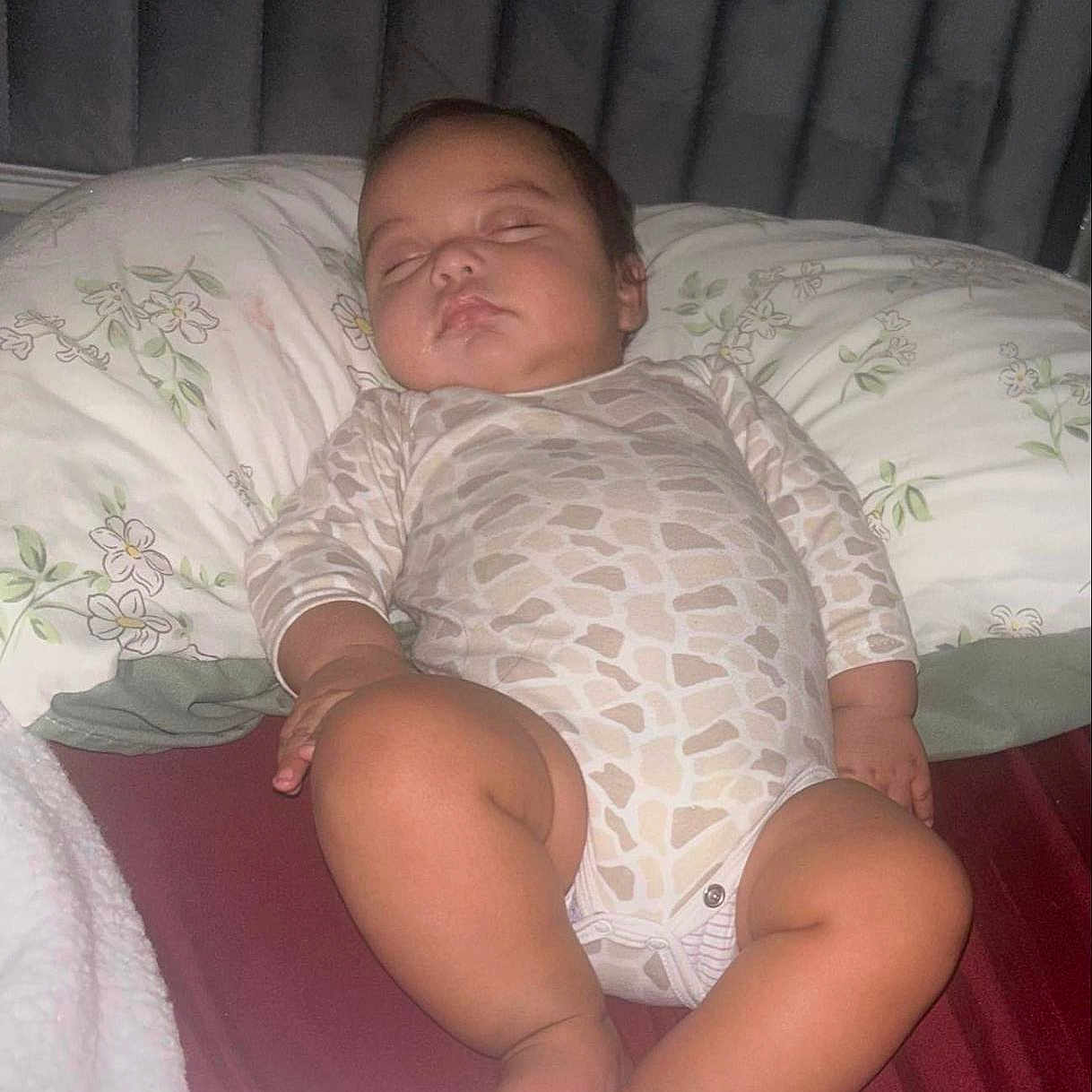 Milan Gael is registered to the contest to win money with this photo: baby, bed, blanket, child, clothing, comfort, curtains, cute, floral, indoor, infant, onesie, pattern, peace, peaceful, pillow, rest, sleeping, soft, young