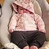 Addilynn joined the competition — help win amazing prizes! baby, infant, hoodie, pink_clothing, baby_seat, indoors, carpet, fireplace, basket, cozy, footwearless, child, cute, relaxed, portrait, home_interior, warm_lighting, casual_clothing, person, seated