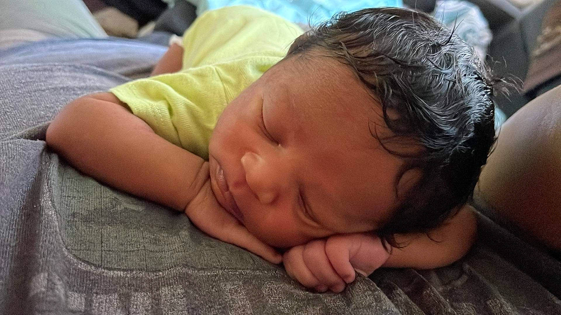 Antonio is registered to the contest to win money with this photo: baby, baby_toddler_clothing, bedtime, cheek, child, comfort, eyelash, flesh, flooring, grass, happy, linens, nap, nose, person, portrait_photography, skin, sleep, toddler, wrinkle