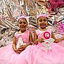 child, birthday, party, pink_dress, tiara, smiling, balloons, celebration, number_4, girls, face_paint, happy, tulle, decorations, birthday_badge, sparkle, crown, festive, portrait, indoor
