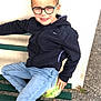 accessories, bench, boy, child, clothing, coat, face, footwear, furniture, glasses, head, jacket, jeans, male, pants, person, photography, portrait, shoe, sitting