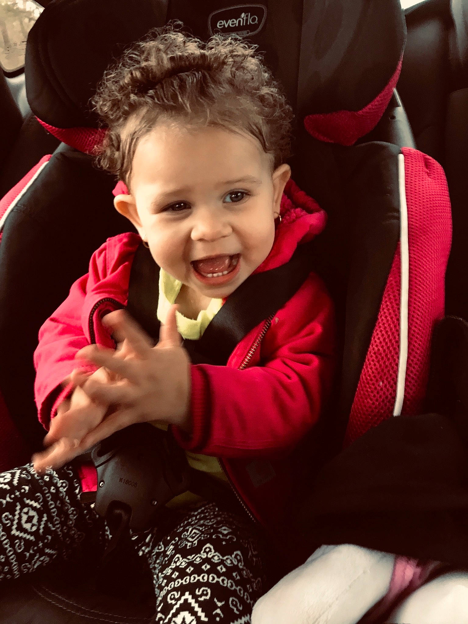 Sapphira joined the competition — help win amazing prizes! arm, baby, beauty, car_seat, cheek, child, eye, face, facial_expression, finger, head, joy, lip, people, person, pink, product, red, sitting, skin