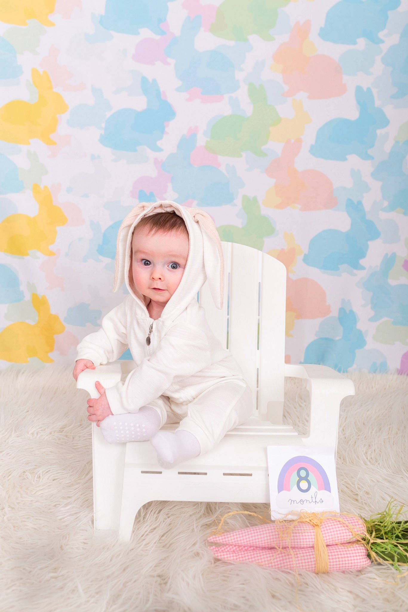 Colson is registered to the contest to win money with this photo: child, comfort, dress, formal_wear, grass, happy, linens, magenta, orange, pattern, peach, person, pink, plant, room, sitting, sleeve, textile, toddler, wallpaper