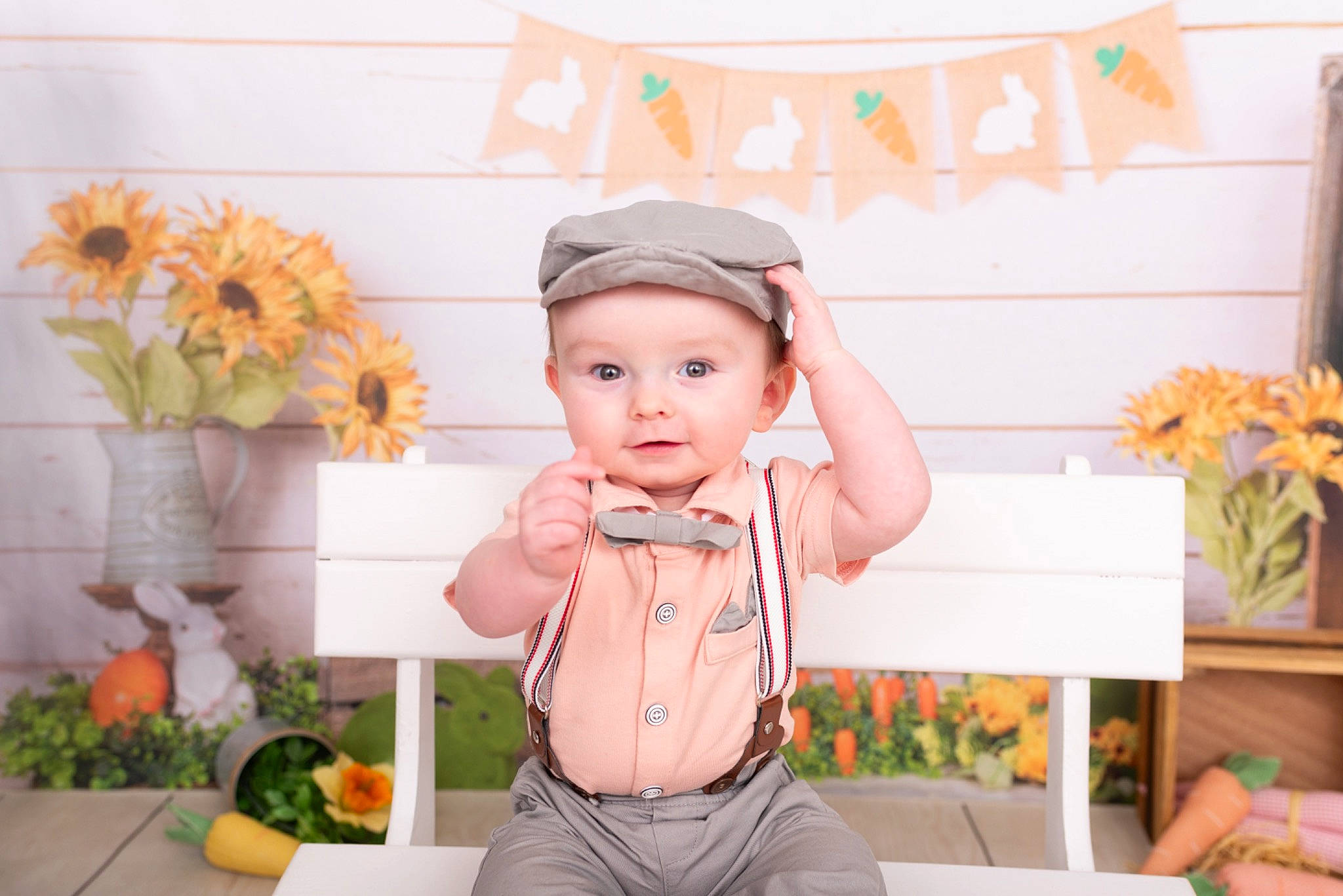 Colson is registered to the contest to win money with this photo: baby, baby_toddler_clothing, baseball_cap, cap, child, fashion_accessory, flower, flower_arranging, happy, hat, headwear, orange, pattern, peach, person, pink, plant, room, sleeve, t_shirt