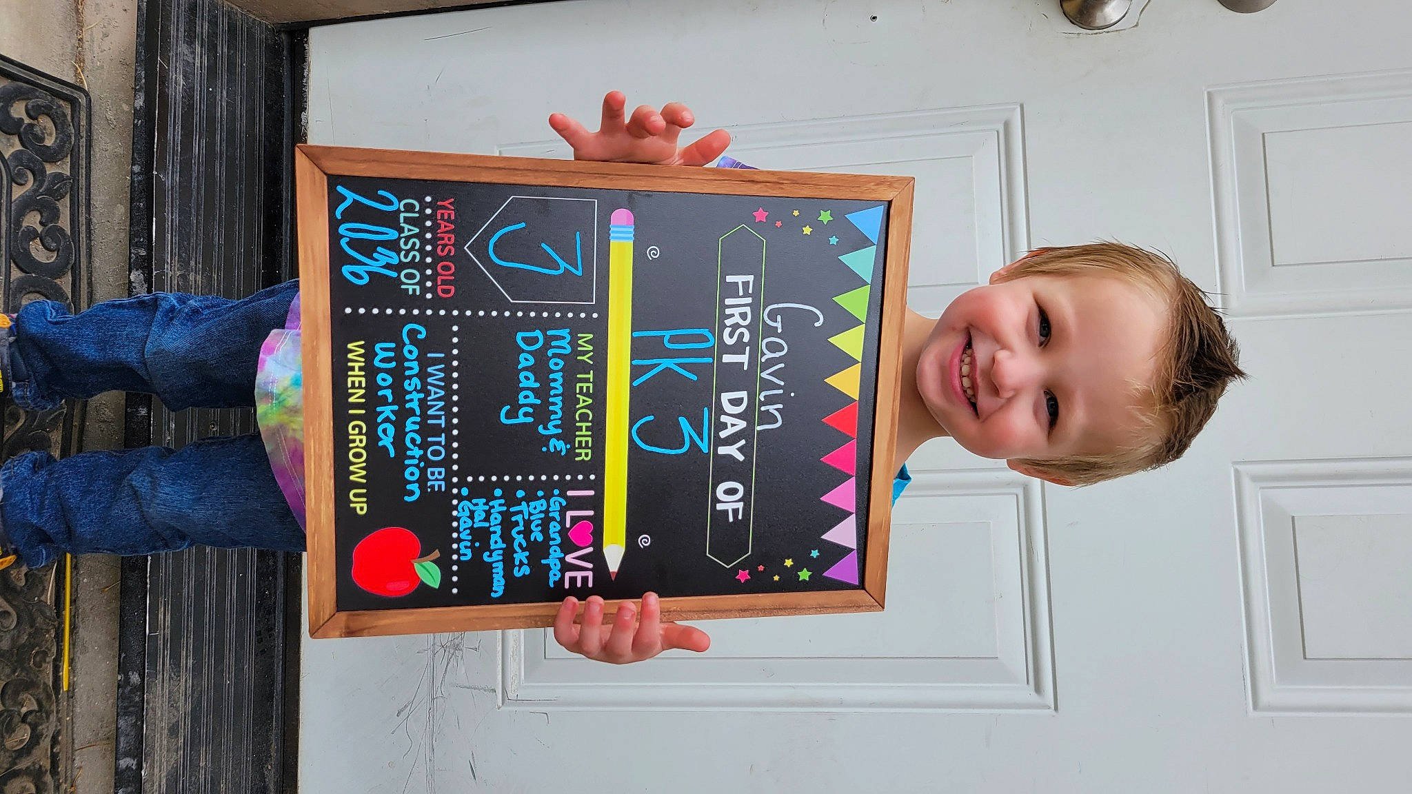 Gavin is registered to the contest to win money with this photo: art, blackboard, building, chalk, child, education, font, fun, glass, handwriting, happy, joy, person, room, signage, slate, smile, t_shirt, teacher, visual_arts