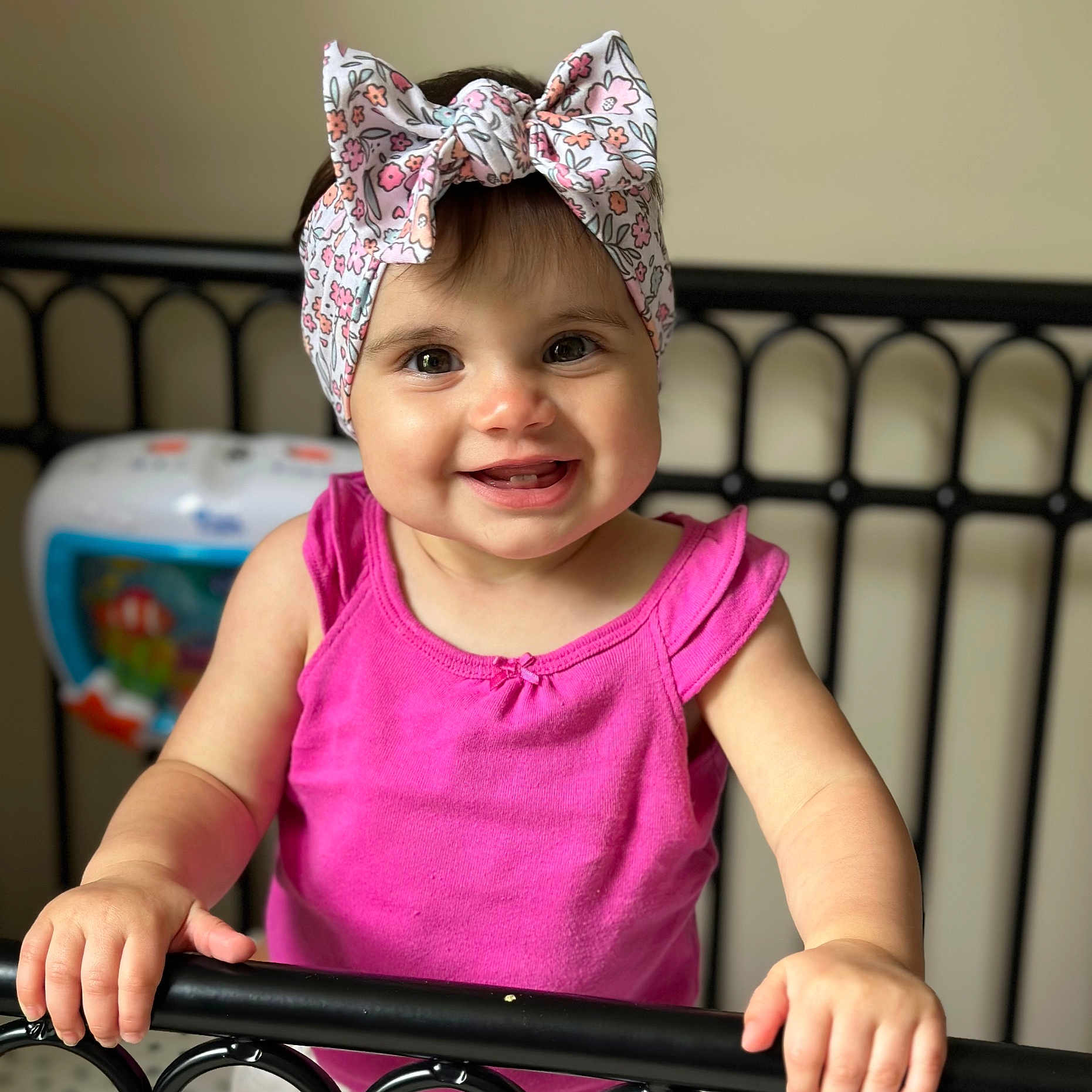 Paityn is registered to the contest to win money with this photo: accessories, baby, bed, bodypart, bonnet, cap, clothing, couch, dress, face, furniture, happy, hat, head, jewelry, person, photography, portrait, railing, smile