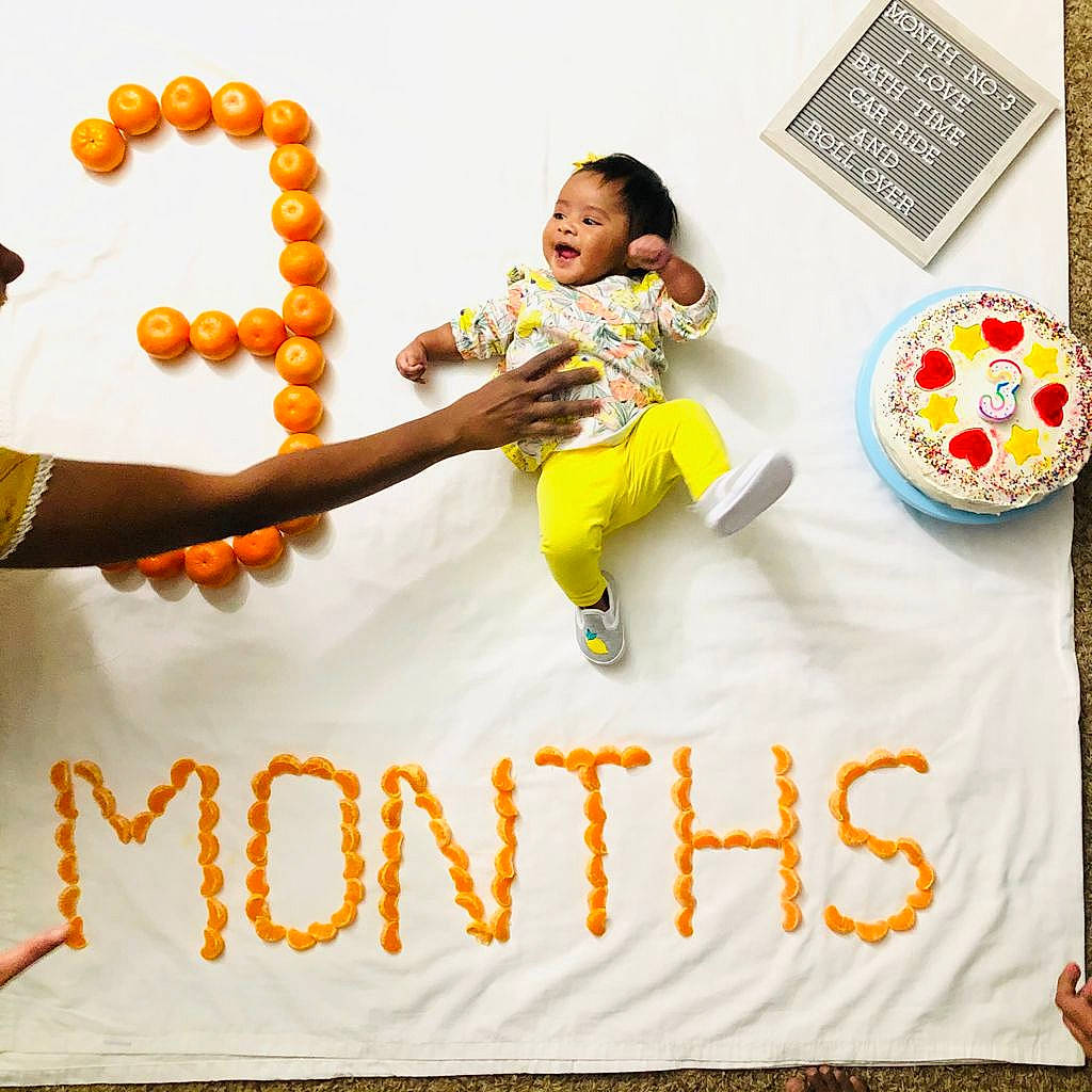 Saanvi is registered to the contest to win money with this photo: baby, baby_toddler_clothing, balloon, child, circle, flooring, font, fun, gesture, happy, linens, person, play, product, rectangle, room, smile, t_shirt, textile, toddler