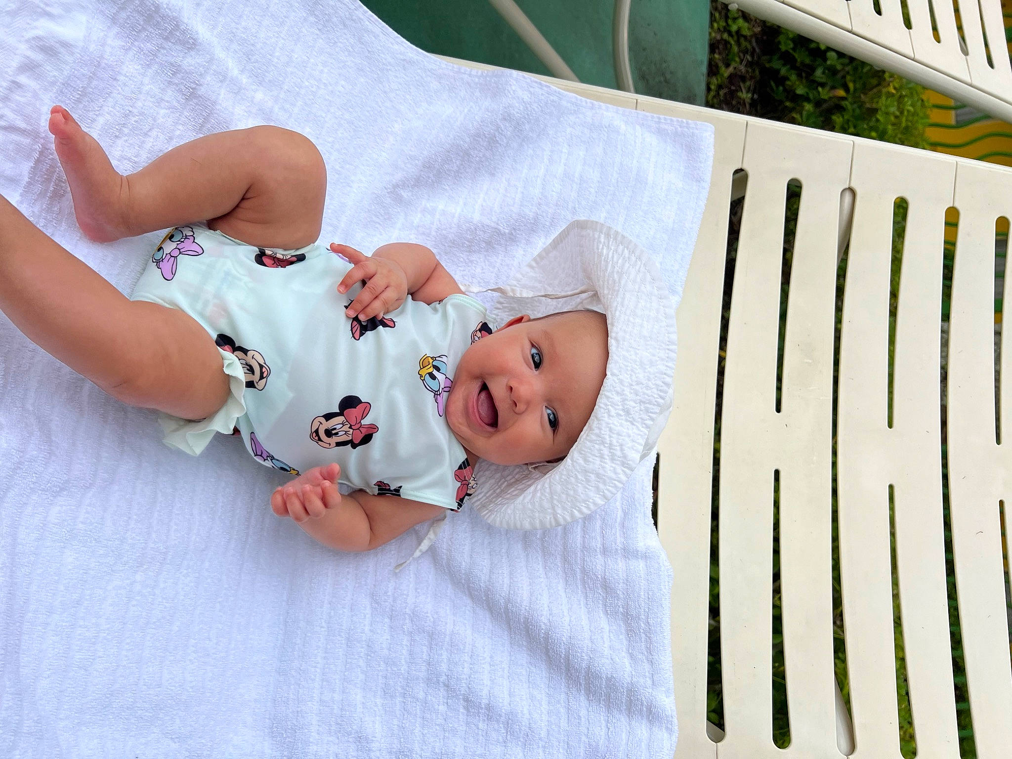 Ivy is registered to the contest to win money with this photo: baby, baby_products, baby_safety, baby_toddler_clothing, child, comfort, foot, grass, happy, hat, headwear, linens, pattern, person, porch, room, sitting, sleeve, t_shirt, textile
