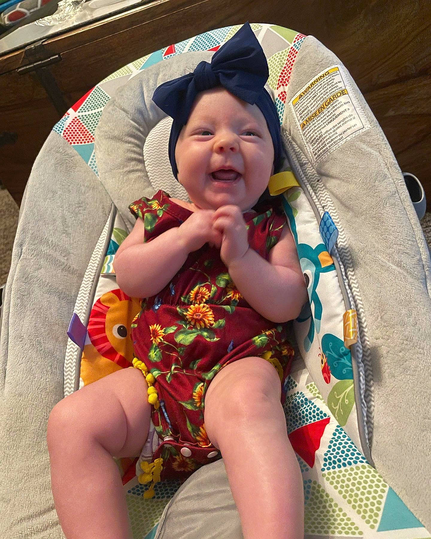 Isobel is registered to the contest to win money with this photo: baby, baby_toddler_clothing, beauty, chair, child, event, fashion_accessory, fun, happy, head, headwear, human_leg, lap, leisure, mouth, person, pink, sitting, skin, smile