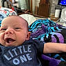 Eli joined the competition — help win amazing prizes! baby, infant, smile, happy, clothing, tshirt, text, blanket, striped, indoor, home, furniture, face, head, arm, person, cute, joyful, newborn, portrait