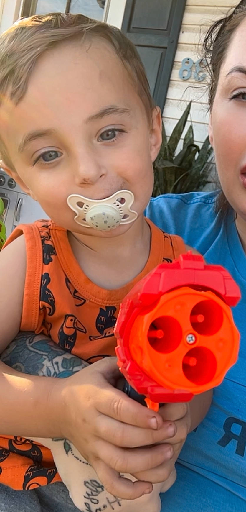 Henry is registered to the contest to win money with this photo: biting, bodypart, cream, dessert, eating, face, finger, food, hand, head, icecream, person, photography, portrait, toy