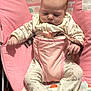 Cheyenne is registered to the contest to win money with this photo: baby, infant, pajamas, pink, baby_seat, seatbelt, polka_dot, pattern, sleepy, indoor, child, cute, soft_fabric, furniture, comfort, resting, small_hands, footed_pajamas, face, head