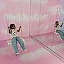 activity, casual_clothing, child, clouds, floor, fun, happy, indoor, jeans, mirror, motion_blur, person, pink, play, reflection, rope, swing, tshirt, wall, young